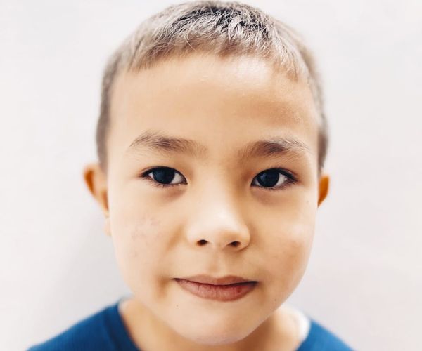 Person looking at a beautiful landscape with a clear and focused gaze.