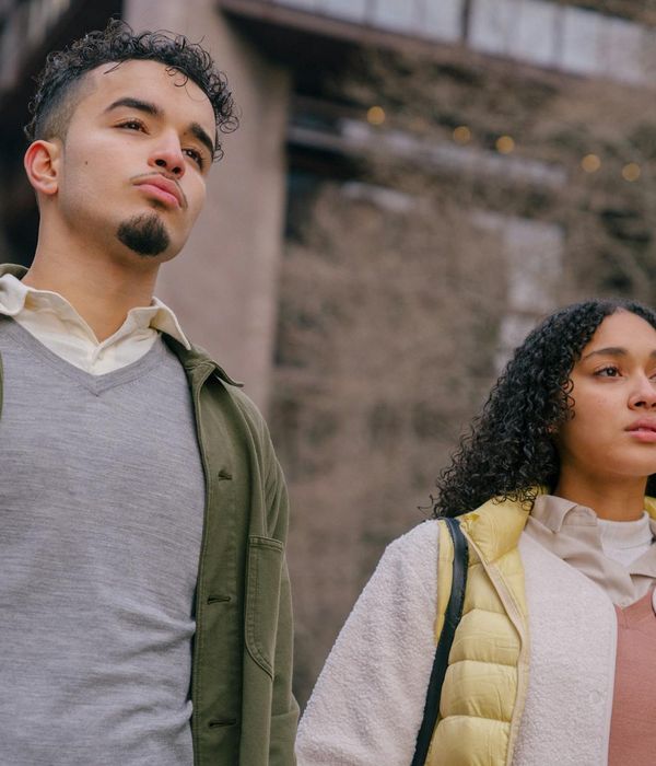 Woman with calm expression focusing her eyes forward.